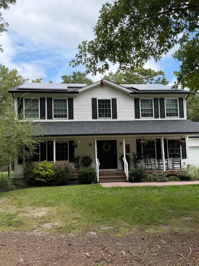 Two-story home with solar panels installed on the roof